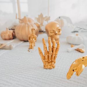 Tischdekoration Skelett Hand (st) gold